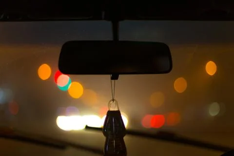 Inside a car with bokeh cork lights at night for background Stock Photos