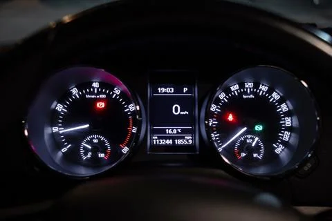 Inside the car, close-up of a circular dashboard, speedometer and tachometer  Stock Photos