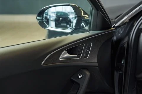 The inside of the car door with adjustable position of the outside rear-view Stock Photos