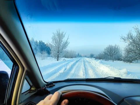 Inside the car. driver behind the wheel. drive a car. journey. bad roads. by  Фото