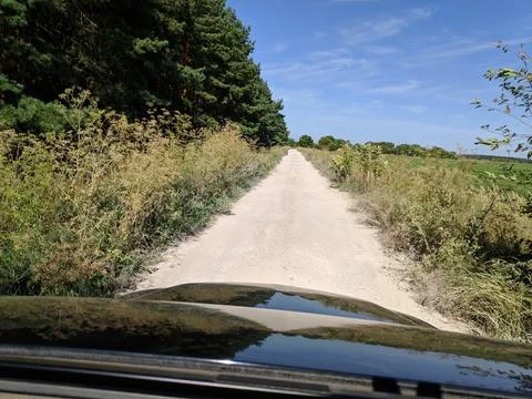 Inside the car. driver behind the wheel. drive a car. journey. bad roads. by  Stock Photos