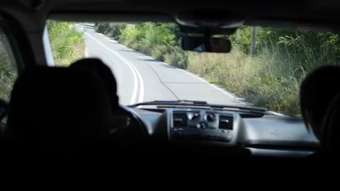 Inside car driver driving with purpose on road. Each turn and straight stretch Vidéo 280305561