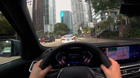 Inside car first person view driving around Miami skyline city streets Video stock 276653398