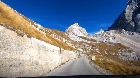 Inside car forward moving driving on mountain road to Mangart saddle Stock Footage 120780430