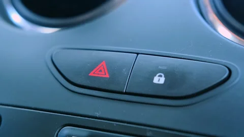 Inside car hazard lights button activated emergency signal system. Red warning Stock Footage 333617548