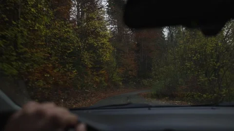 Inside a car on a single lane mountain road in Montenegro, wipers move, wet Stock Footage 329411551