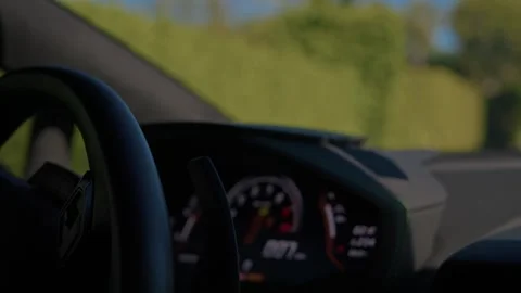 Inside car view driving a luxury supercar along high-end neighbourhood street Stock Footage 277219500