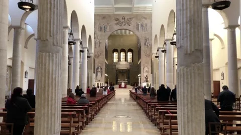 Inside of the cathedral of benevento during a religious ceremony Stock Footage 153787115
