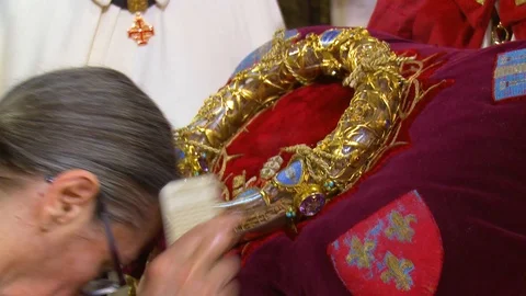 Inside Catholic Notre Dame Cathedral in Paris, religious visitors kiss the holy Stock-Footage 106632721