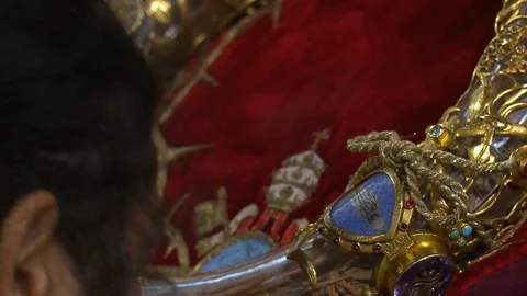 Inside Catholic Notre Dame Cathedral in Paris, religious visitors kiss the holy Stock Footage 106632723