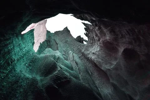 Inside of a cave with a hole in the rock, close up Stock Photos