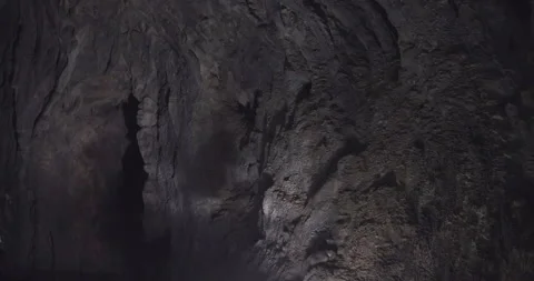 Inside the cave, light beautifully shimmers across the walls Stock Footage 292947166