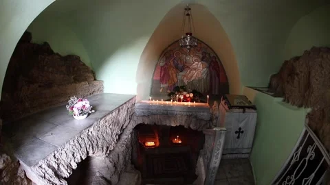 Inside the cave of St. Tabitha. Candles are burning. Prayer. 스톡 동영상 148325226