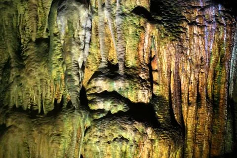 Inside the cave, the wet colored wall background for design. Stock Photos