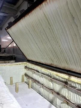 Inside a ceramic kiln, the interior shows heated elements and supports for .. Stock Photos