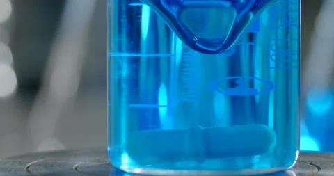 Inside the chemical laboratory: mixing liquid drugs by laboratory equipment, 4k Stock Footage 167605584