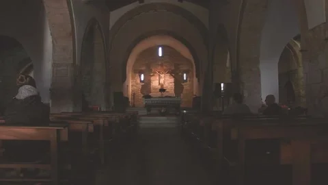 INSIDE OF A CHURCH WITH PEOPLE PRAYING Stock Footage 96383702