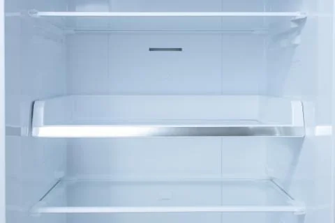 Inside of clean and empty refrigerator with shelves. background for health or Stock Photos