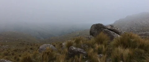 Inside a cloud in the grassy mountains past sunset Video stock 90632355