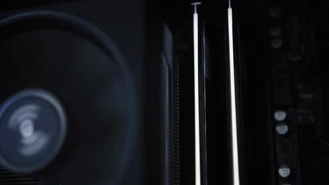 Inside of the computer case, CPU fan and RAM on the motherboard. Stock Footage 123516816