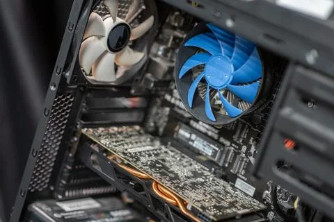 Inside a computer case showcasing components like a graphics card, cooling .. Stock Photos