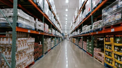 Inside a Costco Wholesale warehouse store with tall shelving stocked with bulk 스톡 동영상 344029355
