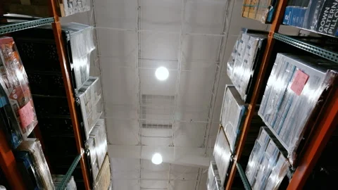Inside a Costco Wholesale warehouse store with tall shelving stocked with bulk 스톡 동영상 344029533
