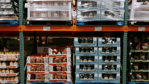 Inside a Costco Wholesale warehouse store with tall shelving stocked with bulk Stockbeeldmateriaal 346802478