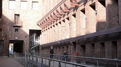 Inside courtyard surrounded by red brick buildings Stock Footage 61010291