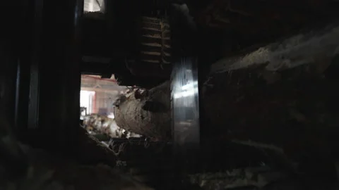 Inside of a cutting machine dealing with wooden log processing at manufacturing Stock Footage 158793312