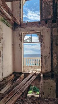Inside a decaying historic building with broken windows Stock Photos
