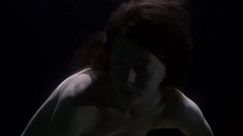 Inside depth of ocean and subconscious mind, female portrait underwater Vidéo 153610565