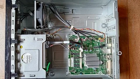 Inside a desktop computer with motherboard, CPU, and RAM visible. Stock Photos