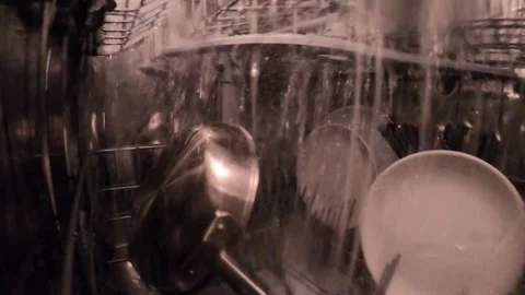 Inside dishwash machine. A view of a working dishwasher machine inside in the Stock Footage 261695627