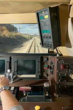 Inside of the drivers cabin of a moving train Stock Photos