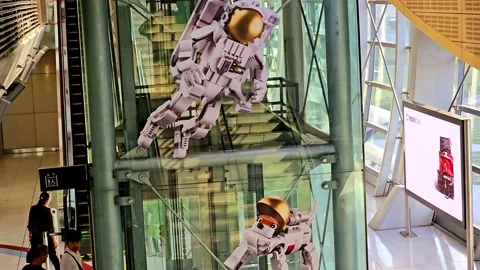 Inside Dubai Metro station, an eye-catching advertisement features robotic Stock Footage 311884123