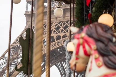 From inside the Eiffel Tower carousel in autumn rain in Paris Stock Photos