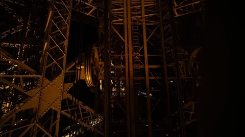 Inside Eiffel Tower, lift elevator, seen at night light up. Romantic honeymoon  스톡 동영상 125496769