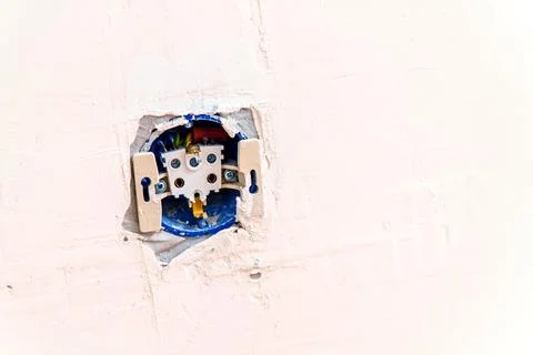 Inside the electrical outlet in the wall Stock Photos