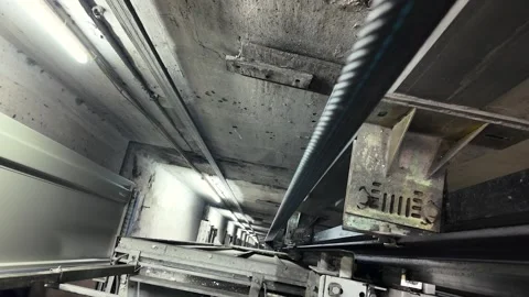 Inside Elevator Shaft Maintenance View Showing Cables and Rails Vídeo Stock 325373891