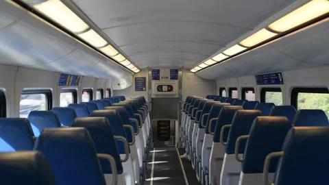 Inside an empty cabin of a Moving Metro Train with empty seats Stock Footage 297393295