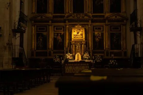 Inside of an empty church in Spain with papers marking security distance agai Stock Photos
