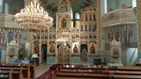 Inside an empty Greek Catholic cathedral. Church interior. Rows for parishioners Stock Footage 252354138