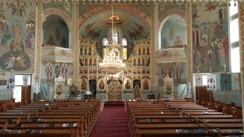 Inside an empty Greek Catholic cathedral. Church interior. Rows for parishioners Stock Footage 252354268