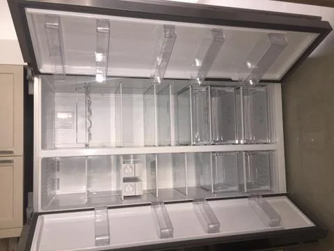 Inside of Empty Grey Double Door Fridge. Inside shelves of brand new refriger Foto stock