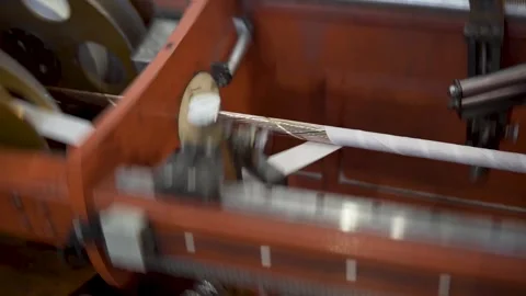 Inside the factory, equipment that wraps cables in insulation Stock Footage 306300086