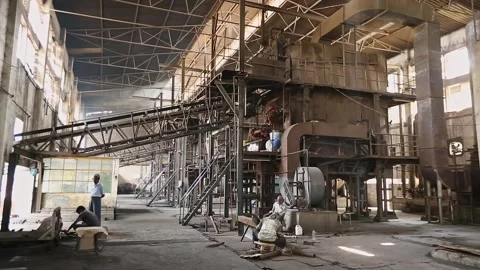 Inside the factory, machines and workers collaborate in the production proces 스톡 동영상 244990497