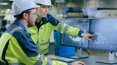Inside Factory Male Mechanical Engineer Works on Personal Computer Stock Footage 93685601