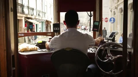 Inside famous old trolley in Lisbon Tram driver of historic tram train streetcar Video stock 222154958
