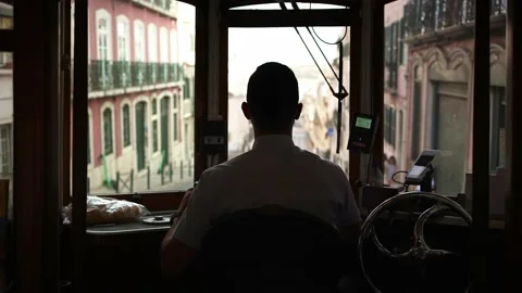 Inside famous old trolley in Lisbon Tram driver of historic tram train streetcar Video stock 222155075